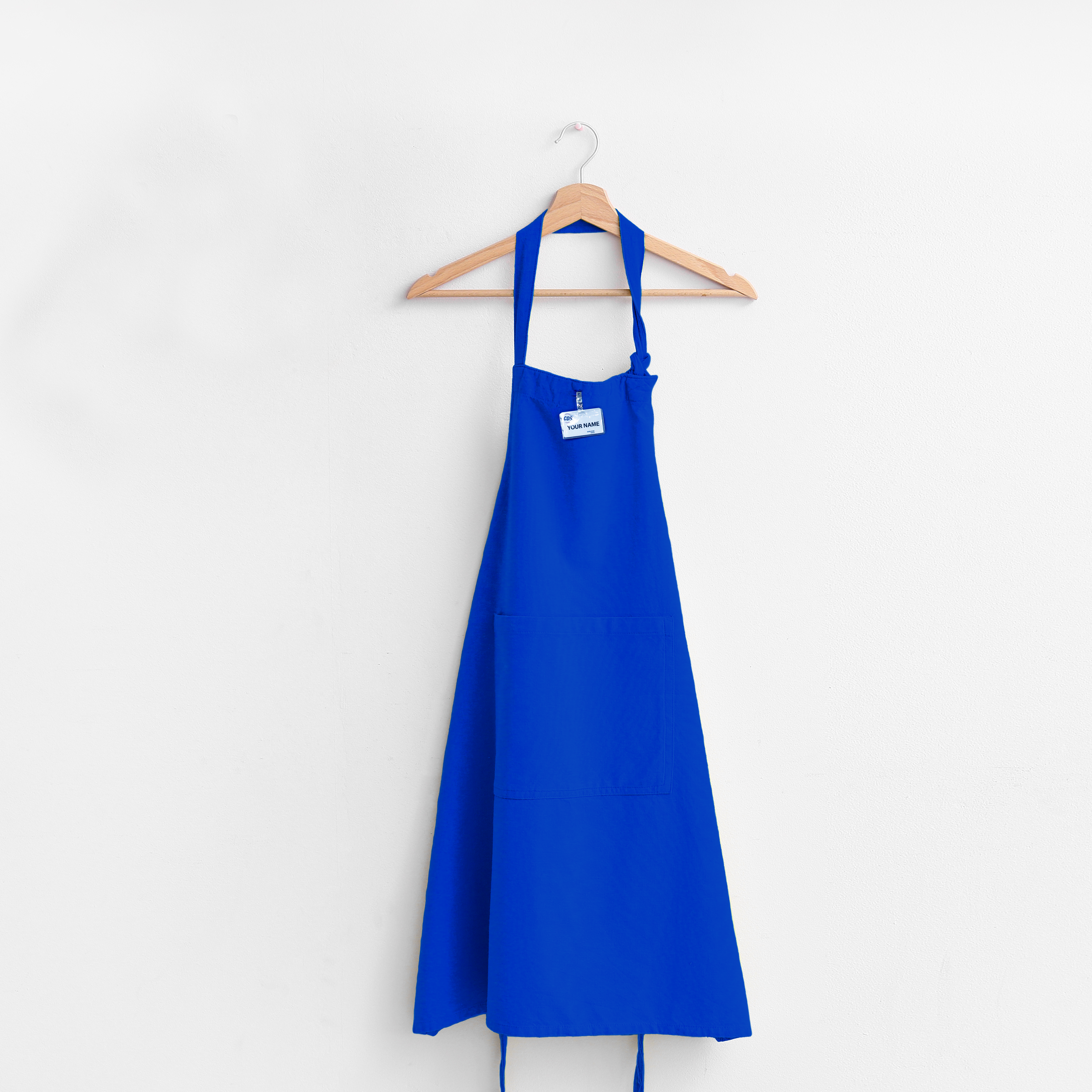 Blue apron hanging on a hanger